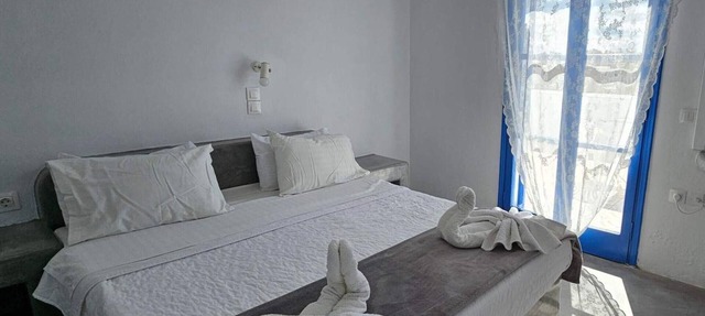 Classic Quadruple Room 1 with Balcony and Air Conditioning in Perissa