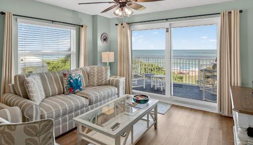Direct oceanfront 2/2 corner condo with large balcony, heated pool, and garage parking in Ormond Beach