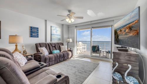 Direct oceanfront 2/2 condo with large private balcony, heated pool, and garage parking in Ormond Beach
