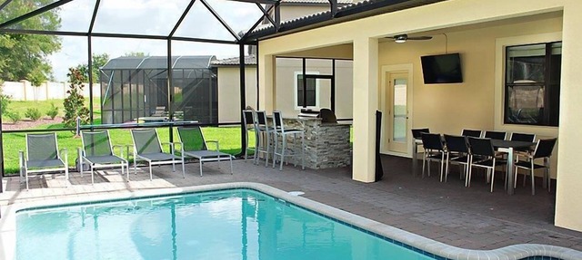 Luxury 5 bed; outside BBQ/TV area with South facing pool in Championsgate