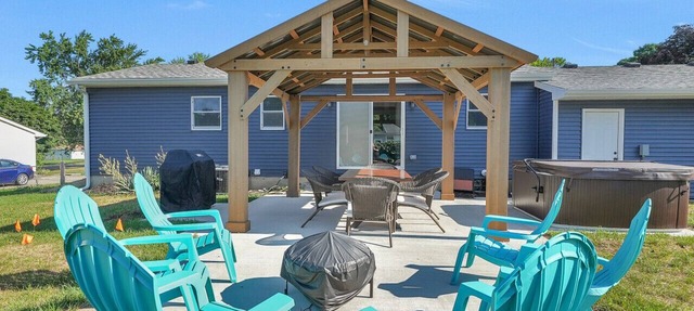 Mid-Century Modern | Hot Tub | Game Room | Fenced Yard | 4BR 2BA | EV Charger in Grand Rapids