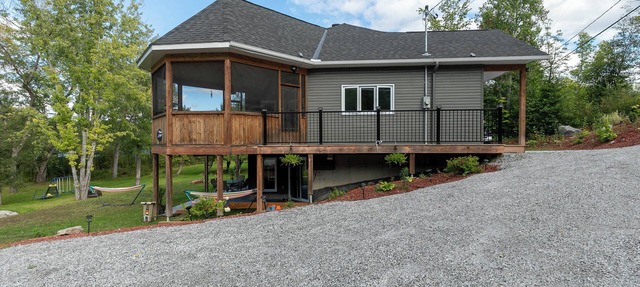 Modern Lakefront Chalet with Games Room, Gym, Wrap Around Balcony & Scenic Views in Bouchette