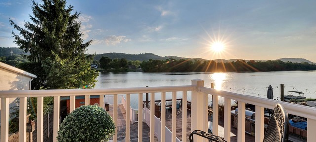 Waterfront condo with large decks and a dock for summer fun centrally located. in Bancroft